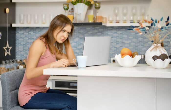 Woman works remotely from home Young woman works remotely from home